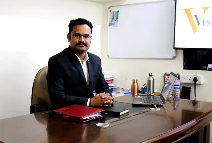 Mr. Ganesh Sakhare, Managing Director, Varad Automation & Robotics Pvt. Ltd., at his desk in the Bhosari works