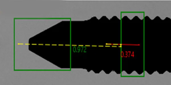 Bleeder screw camera view: part silhouette with the measurement overlays — thread and cross-hole with measurement lines