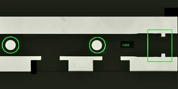 Thru Scan camera view: part silhouette with the measurement overlays — grooves and steps of a shaft