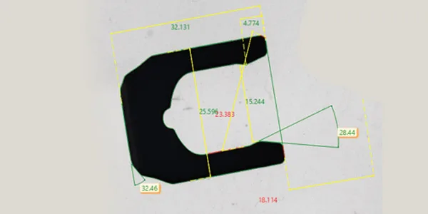 Vertical Visigauge camera view: part silhouette with the measurement overlays — a C-shaped stamping with lengths and radii marked